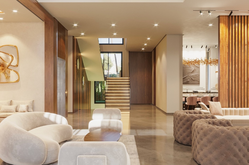 Grand séjour contemporain aux canapés bouclé crème, fauteuils capitonnés, escalier et lustre doré, signé LB Design